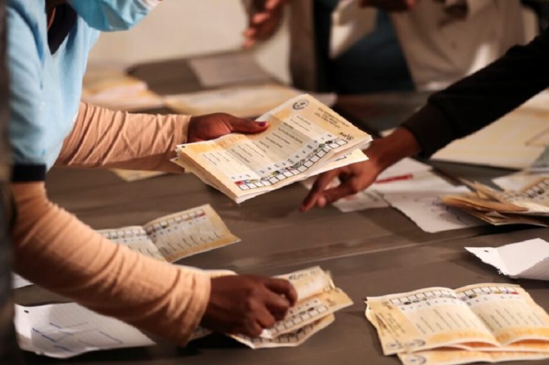 Election officials count ballots after the closing of the local government elections, at a farm in Alewynspoort, outside Johannesburg, South Africa November 1, 2021.